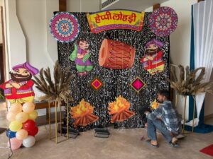 Lohri Theme Decoration with Punjabi Folk Backdrop & Sequin Setup